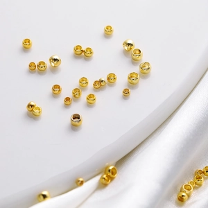 Macro shot of 18K gold plated copper spacer beads with smooth mirror finish for DIY jewelry