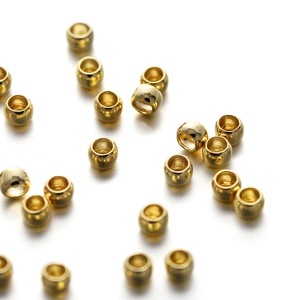 Detailed view of polished 18K gold plated spacer beads for DIY jewelry making
