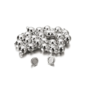 Detailed macro view of spherical silver magnetic clasps for DIY jewelry necklace making