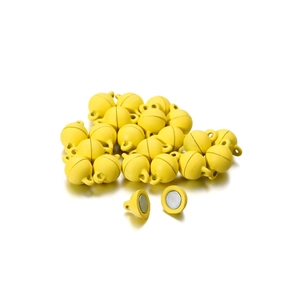 Macro detail of yellow spherical magnetic clasps for DIY jewelry necklaces and bracelets