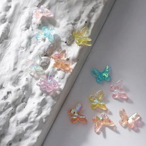 Detailed macro view of 3D resin aurora butterflies with vibrant iridescent finish