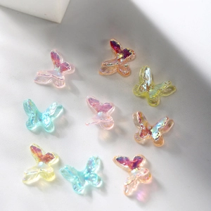 Macro shot of 3D aurora resin butterfly charms with colorful gradient finish for DIY crafts