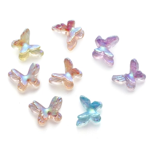 Macro shot of iridescent resin mini butterflies with pearl finish for DIY craft accessories