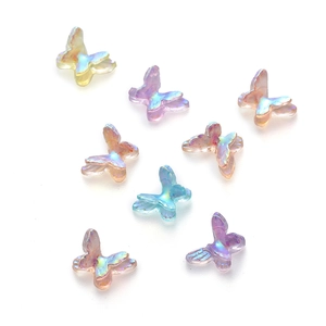 Macro shot of 8 colorful AB resin mini butterflies for DIY nail art and phone cases