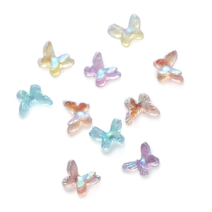 Mini iridescent aurora butterfly resin charms in assorted pastel colors for DIY crafts