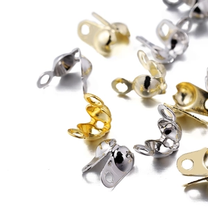 Macro shot of 14K and 18K gold-filled bead tips and calotte ends for jewelry making