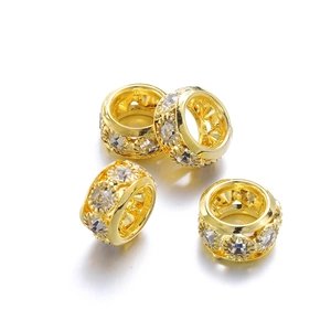 Vue détaillée de 4 perles d'espacement en cuivre doré avec zircons pour bijoux DIY