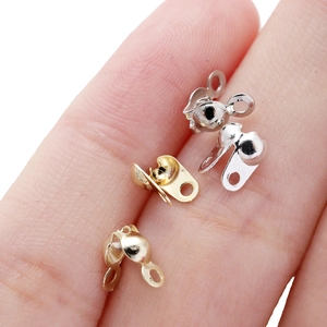 18K gold and silver plated bead chain calotte crimps connector shown on finger for scale