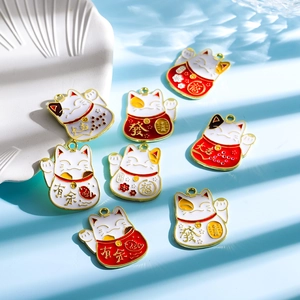 Detailed view of alloy Maneki-neko pendants with colorful enamel lucky symbols