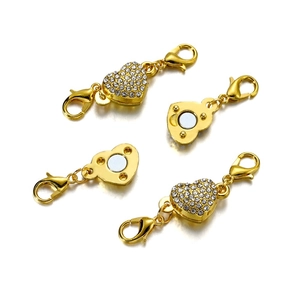 Detail of heart-shaped magnetic jewelry clasp with rhinestones and lobster hooks