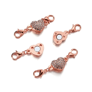 Detail of rose gold heart magnetic clasp with white rhinestones and lobster claws