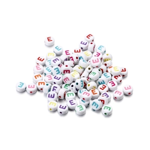 Macro shot of colorful acrylic alphabet beads with round flat shape for DIY jewelry making
