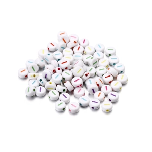 Macro shot of white acrylic alphabet beads with colorful stripes for DIY jewelry making
