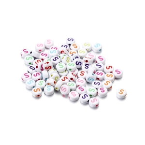 Macro shot of white acrylic letter S beads with colorful centers for DIY jewelry making