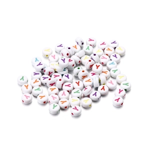 Close-up of colorful acrylic letter Y beads on white background for DIY jewelry making