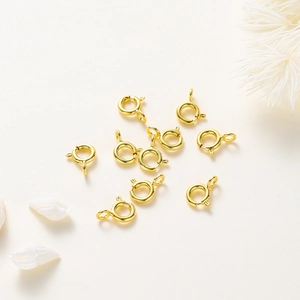 Close-up of 18K gold plated spring ring clasps for DIY jewelry making accessories