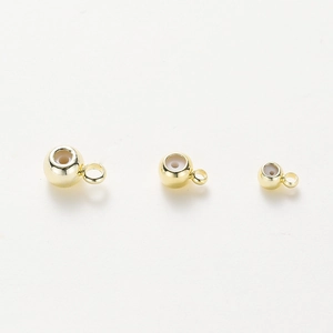 Dettaglio di perline di arresto in oro 18K con anima in silicone per gioielli DIY