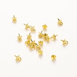 Detailed view of 14K gold-plated petal-shaped pearl cups and bails for jewelry making