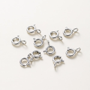 Close-up of high-polish 18K gold-plated spring ring clasps for jewelry making and necklaces