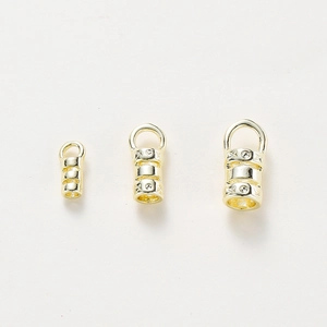 Detailed view of three sizes of 18K gold plated brass bail clasps with geometric patterns