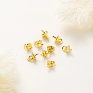 Detailed macro view of 14K gold plated pumpkin seed cap pin pearl bail for DIY jewelry