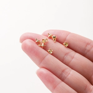 14K gold plated copper pearl cup pins for DIY jewelry making held in hand for scale