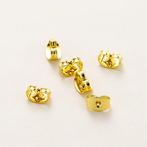 Macro shot of 18K gold-plated butterfly ear nuts with a polished finish and scroll design
