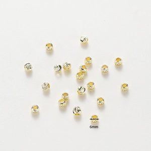 Detail of 6mm 18K gold plated copper beads with spiral texture for DIY jewelry
