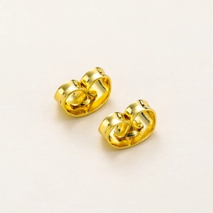 Macro detail of high-quality 18K gold-plated copper butterfly earring backings