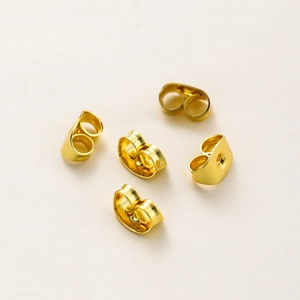 Close-up of 18K gold-plated copper butterfly earring backs for jewelry making