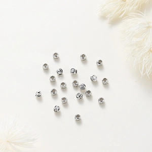 Close-up of spiral textured silver-plated copper beads for DIY jewelry making