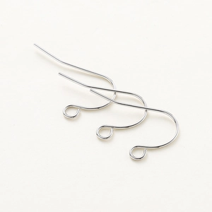 Close-up of polished silver earring hooks with closed loops for DIY jewelry making