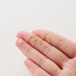 Three classic 14K gold plated brass ear hooks for DIY jewelry making held in hand