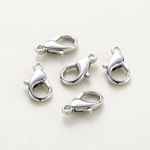 Detailed view of five silver-plated lobster clasps for DIY jewelry making sets