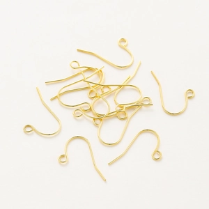 Macro view of polished 14K gold-plated fish hook earring wires for DIY jewelry making