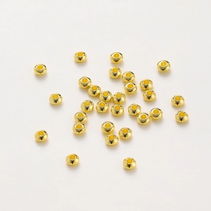 Macro shot of 18K gold plated rondelle spacer beads for DIY jewelry making