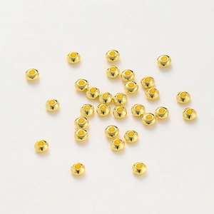 Macro shot of 18K gold plated spacer beads with polished mirror finish for DIY bracelets