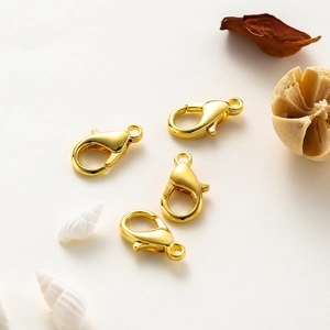 Macro view of 14k gold plated lobster clasps for DIY jewelry making and necklace crafts
