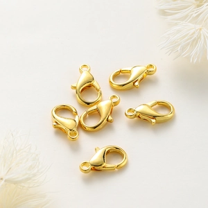 Detailed close-up of six premium gold-plated lobster clasps for DIY jewelry making