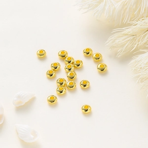 Macro shot of 18K gold plated abacus beads for DIY jewelry making and bracelet design