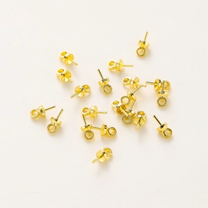 Detail of 14K gold plated brass ear stud findings with flat base for DIY jewelry making