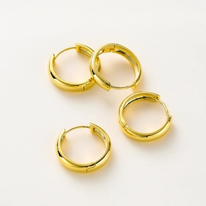 Detail view of four 14K gold plated minimalist round hoop earrings with glossy finish