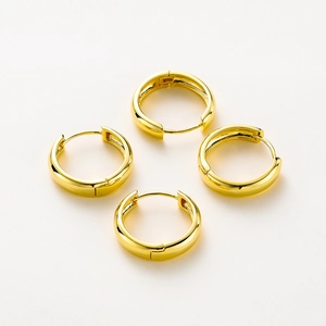 Close-up of four 14K gold-plated smooth hoop earrings with secure click-top closure