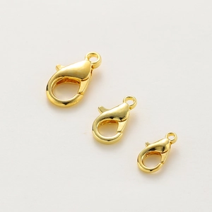 Three sizes of 14k gold-plated lobster clasps with smooth metallic luster on white background