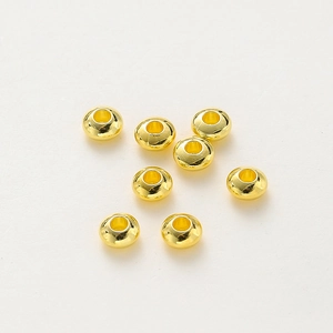 Close-up of 18K gold plated rondelle spacer beads for DIY bracelet jewelry making