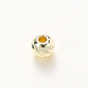 Detailed view of 14K gold-plated spacer bead with leaf texture for DIY jewelry making