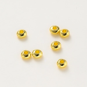 Macro shot of 18K gold plated smooth spacer beads for DIY jewelry making and bracelets
