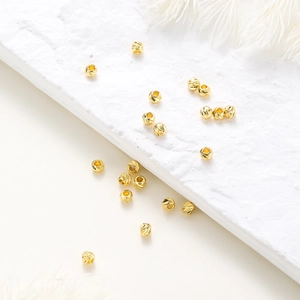 Close-up of 14K gold plated faceted spacer beads for DIY jewelry making accessories