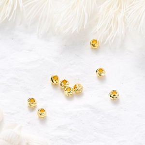 Macro shot of 14K gold plated faceted beads for DIY jewelry making and spacing