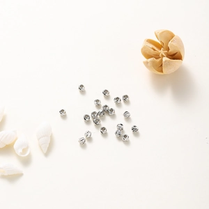 Detailed macro shot of silver-plated faceted spacer beads for DIY jewelry making designs